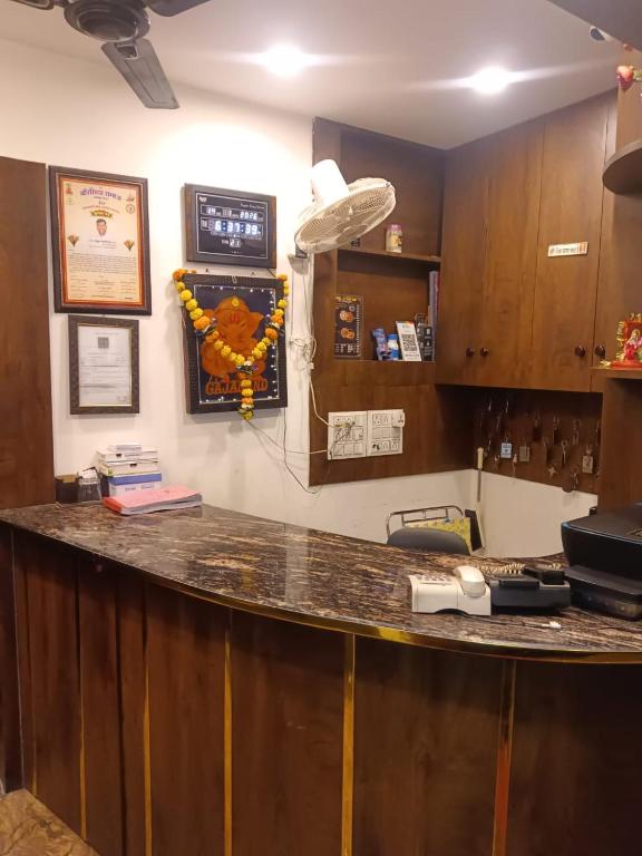 a bar in a room with a counter top at hotel atithi palace in Jabalpur