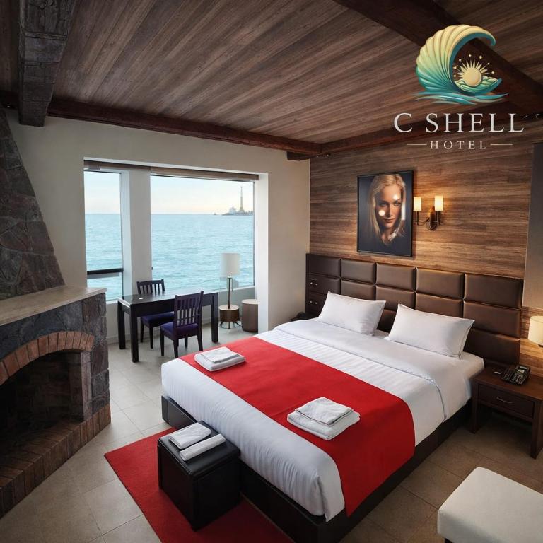 Llit o llits en una habitació de C Shell Hotel
