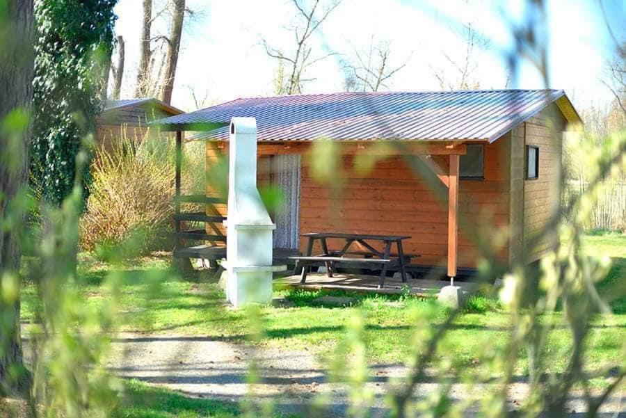 a cabin with a picnic table in front of it at Kemp Karvánky in Dráchov