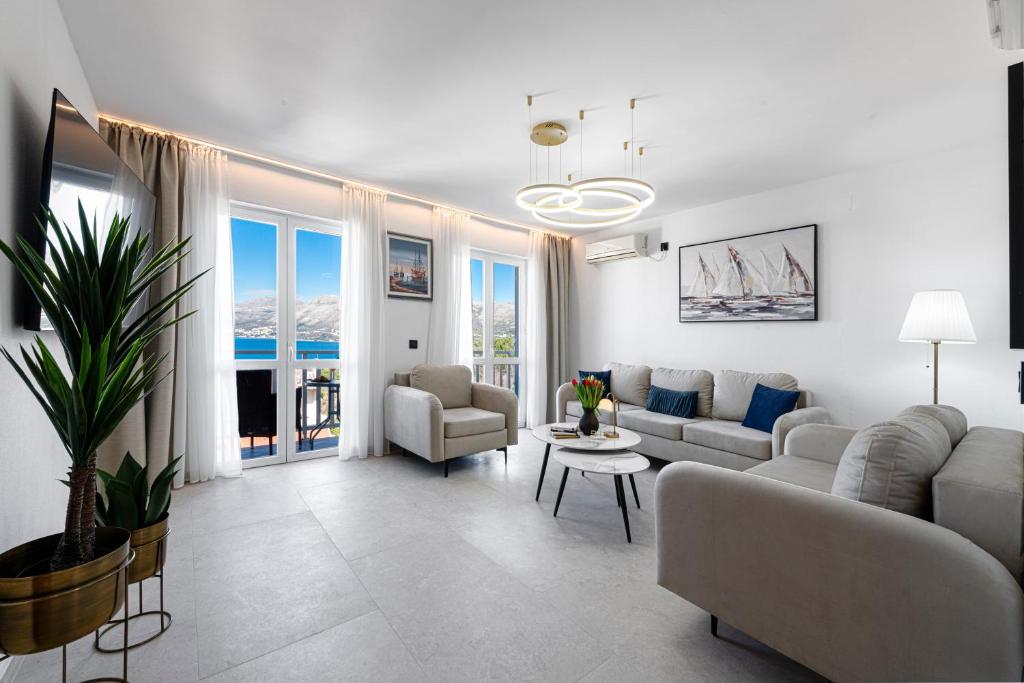 a living room with a couch and a table at Villa Nick in Cavtat