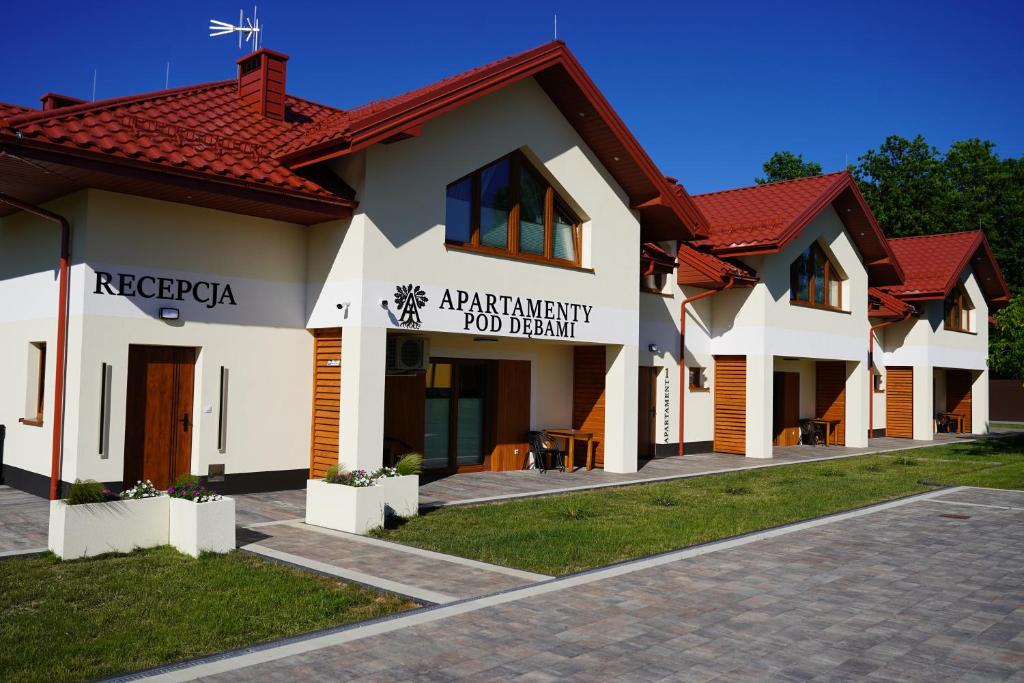 a building with a sign that reads independent food benefit at Apartamenty pod Dębami - noclegi Beskid Niski in Odrzechowa