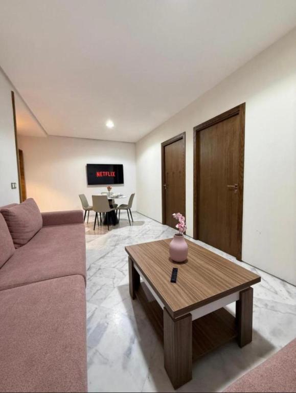a living room with a couch and a coffee table at Central Sweet Stay in Tangier