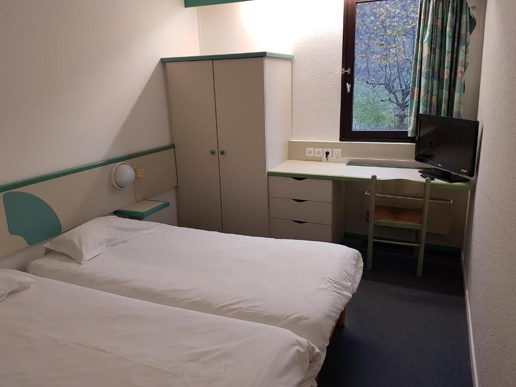 Postel nebo postele na pokoji v ubytování Hotel Inn Design Moutiers