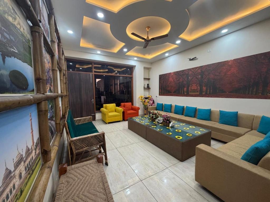 a living room with a couch and a table at pearl green's in Anandpur Sāhib