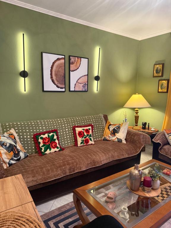 a living room with a couch and a table at 4 Seasons Apartment in Leskovik