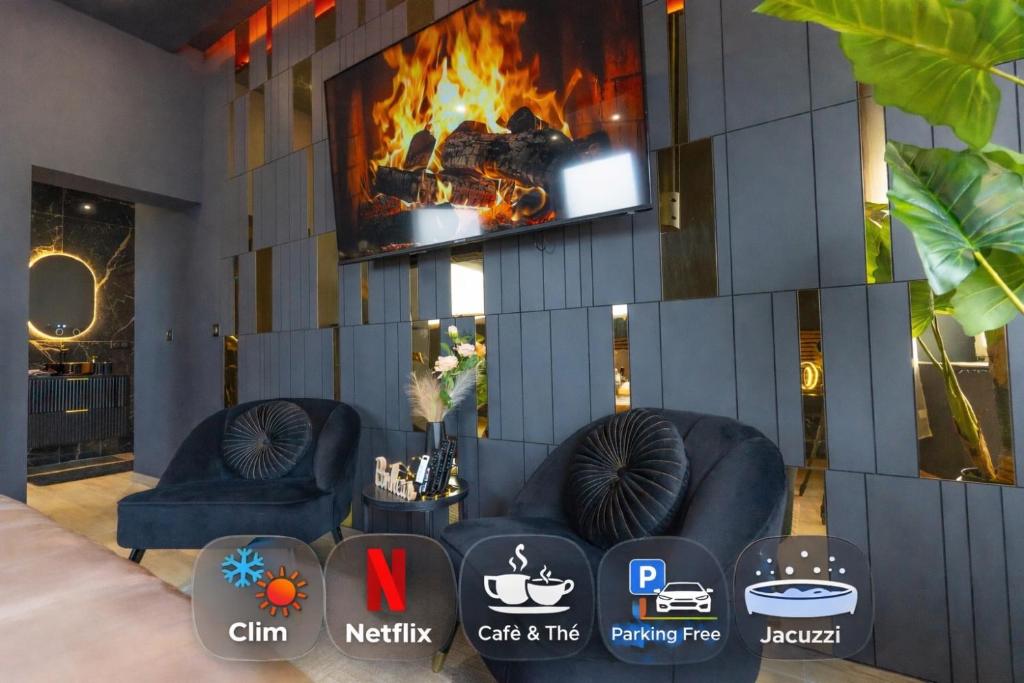 a room with two couches and a fireplace at L'élégance - Suite Romantique - Jacuzzi Privatif in Sarrebourg