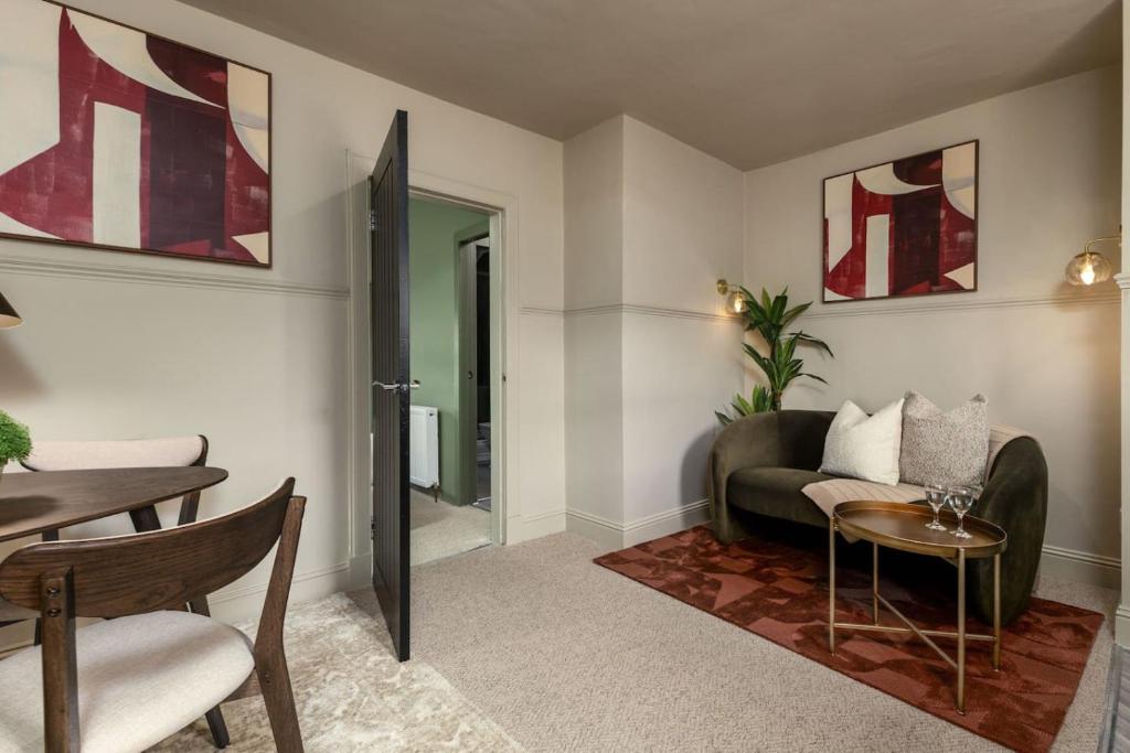 a living room with a couch and a table at The Wallace Suite by The Wallace Monument in Stirling