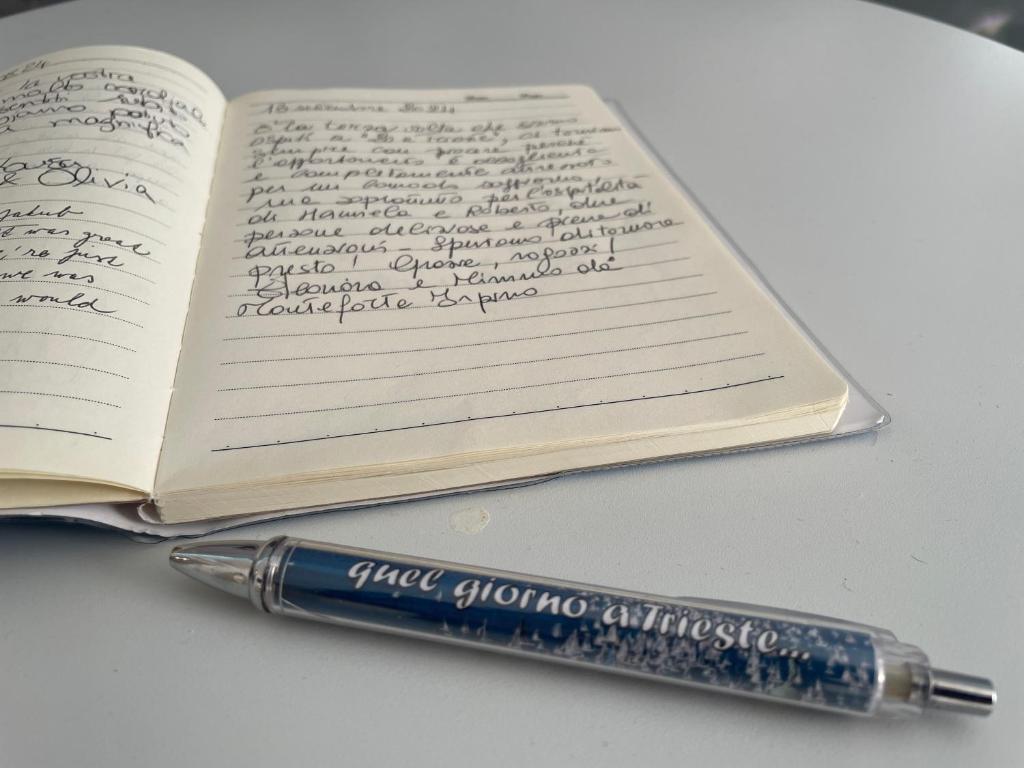 a pen sitting on top of a book at 20 a Trieste in Trieste