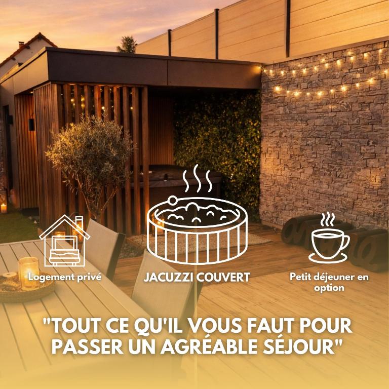 a sign on the side of a house with a cup of coffee at Le Petit Nid D'Amour in Évans