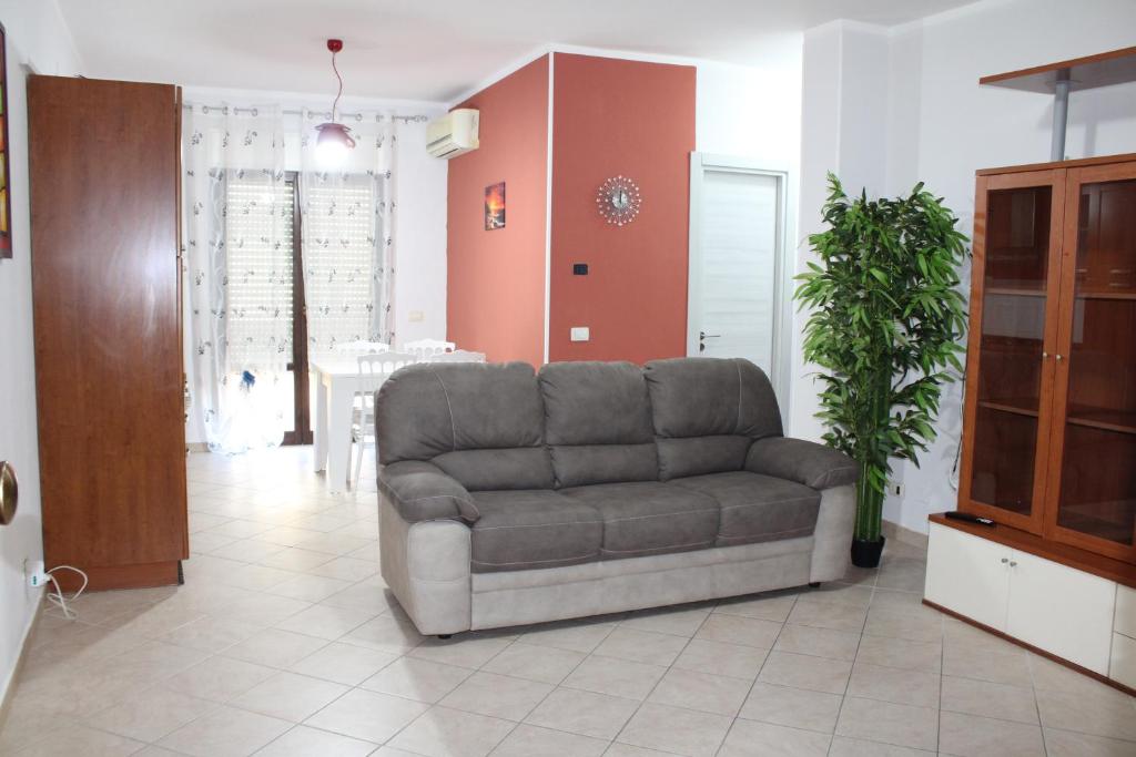 a living room with a couch and a table at Catherine Suite in SantʼEufemia Lamezia