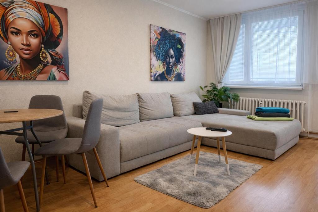 a living room with a couch and a table at Apartmán MARKI in Malacky