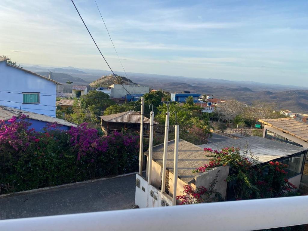 a view of a city from the balcony of a house at Suíte prime in Monte das Gameleiras