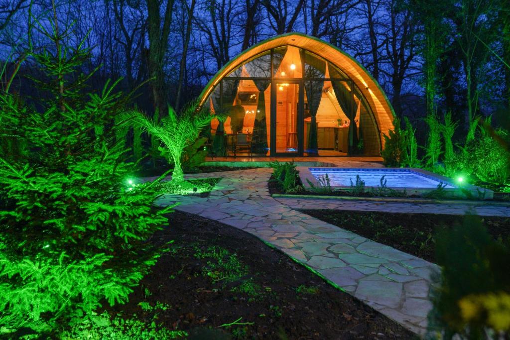 a home with a dome house in the woods at night at Cottage TKESHI in Godogani
