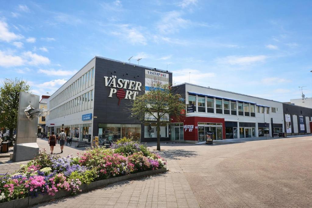a shopping center with people walking in the street at Hotell Navet in Västervik