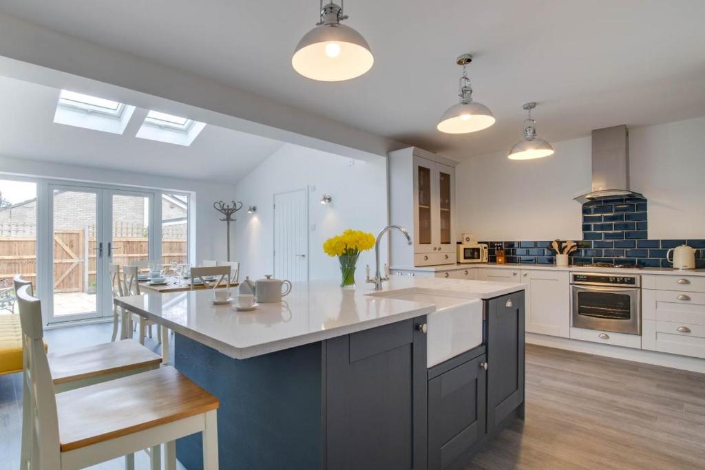 a kitchen with a large island in the middle at 3 Bed in Woodbridge oc-30mor in Woodbridge