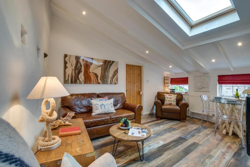 a living room with a couch and a table at 1 Bed in St. Ives oc-drift4 in St Ives