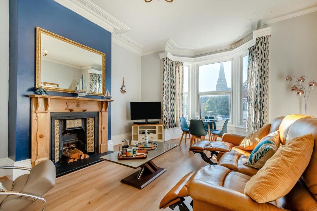 a living room with a couch and a fireplace at 1 Bed in Bridlington oc-t30002 in Bridlington