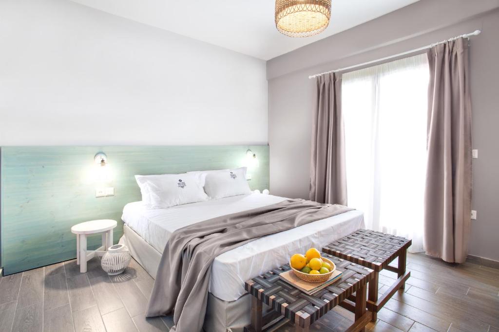 Postel nebo postele na pokoji v ubytování Nissos Rooms Ammouliani