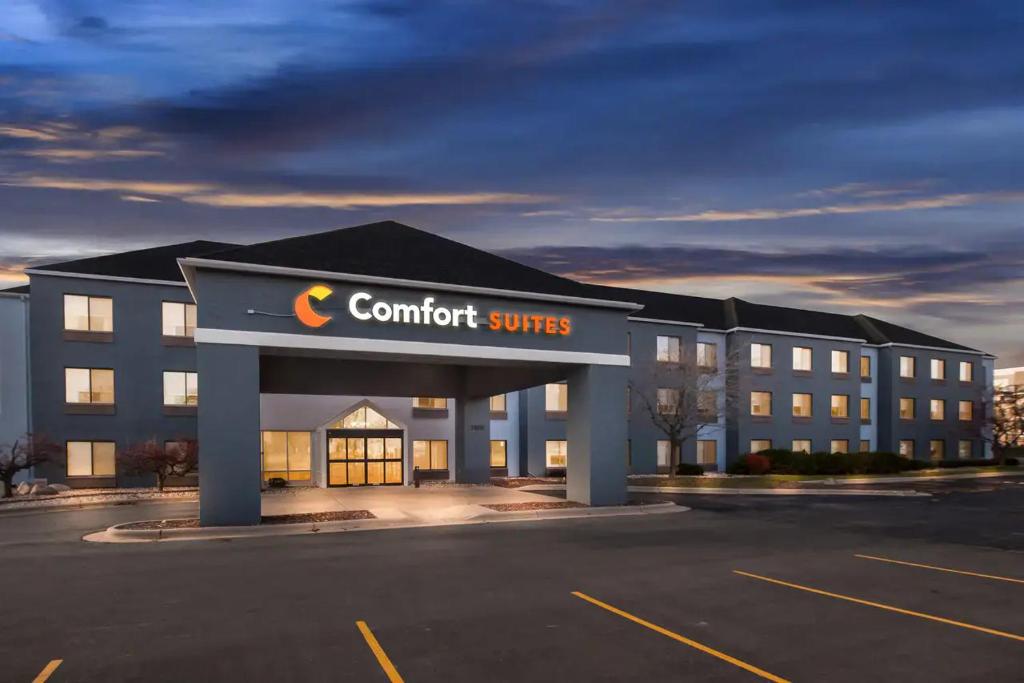 a rendering of a hotel with a comfort suites sign in a parking lot at Comfort Suites Stevens Point in Stevens Point