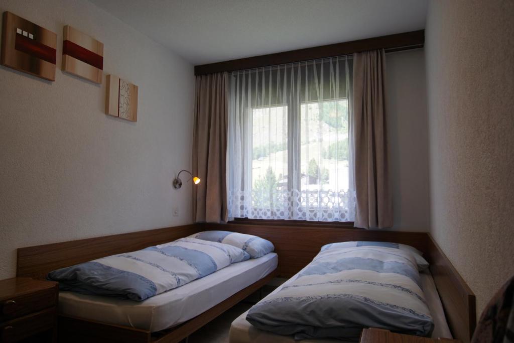 Postel nebo postele na pokoji v ubytování Haus Amor
