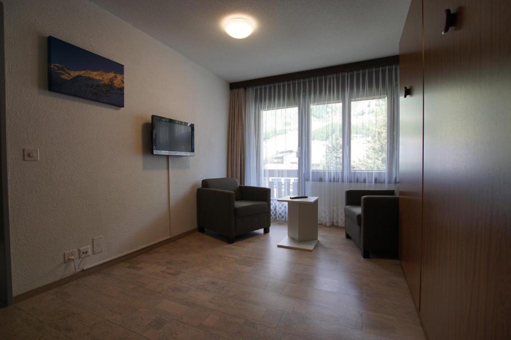 TV a/nebo společenská místnost v ubytování Haus Amor