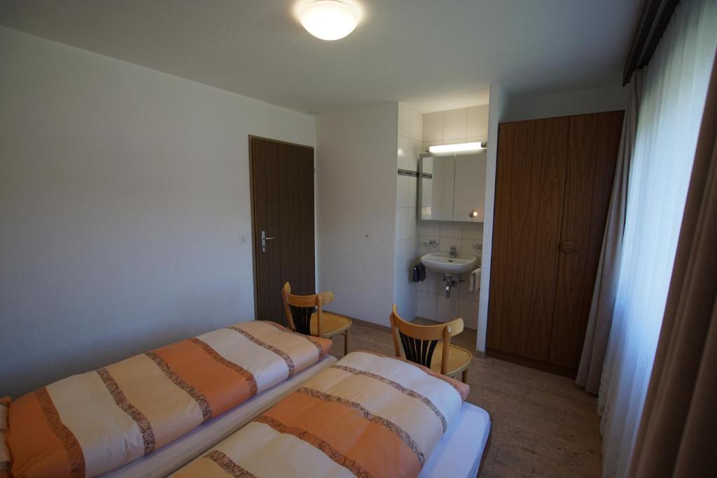 Postel nebo postele na pokoji v ubytování Haus Amor