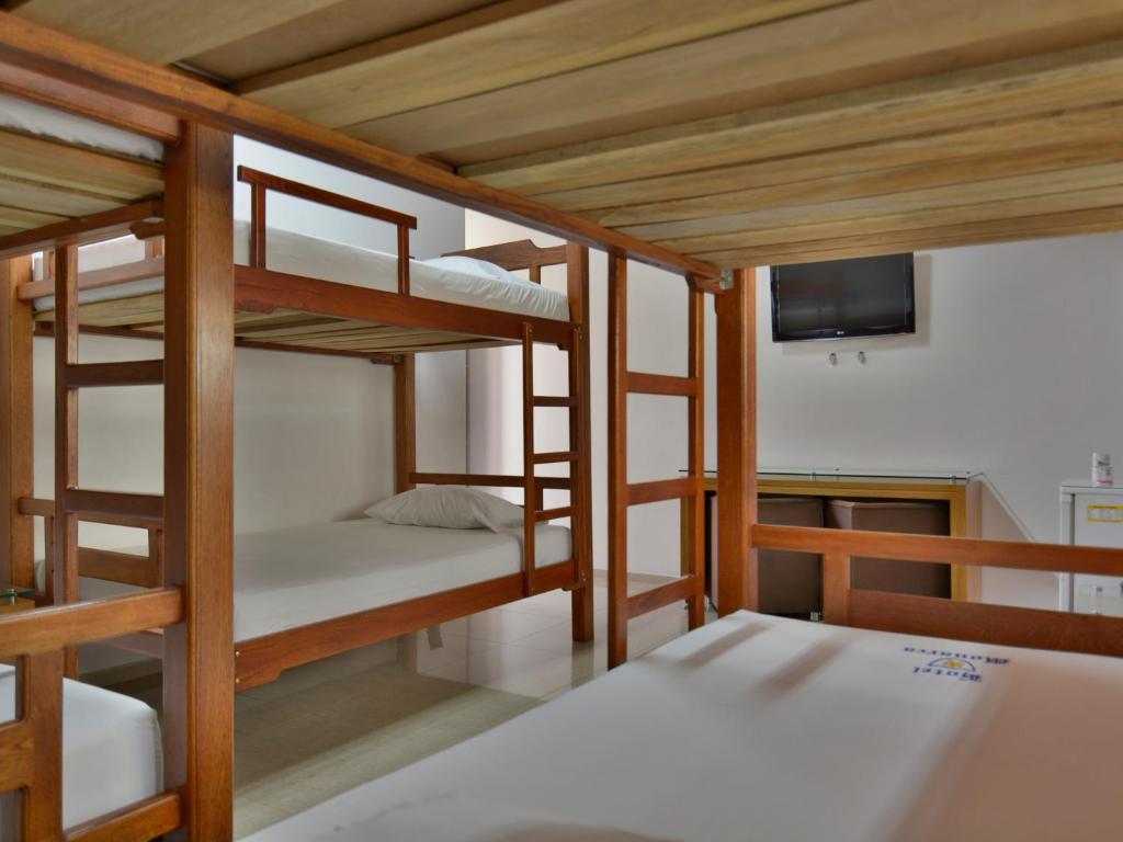 Postel nebo postele na pokoji v ubytování Hotel Monarca