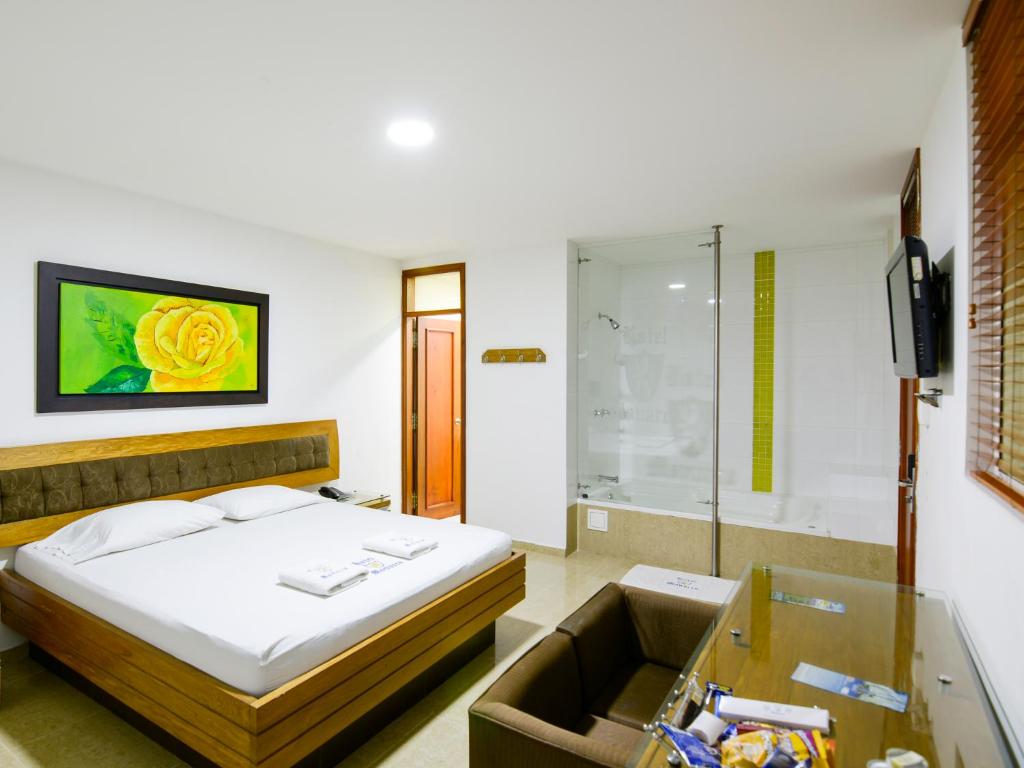 Postel nebo postele na pokoji v ubytování Hotel Monarca