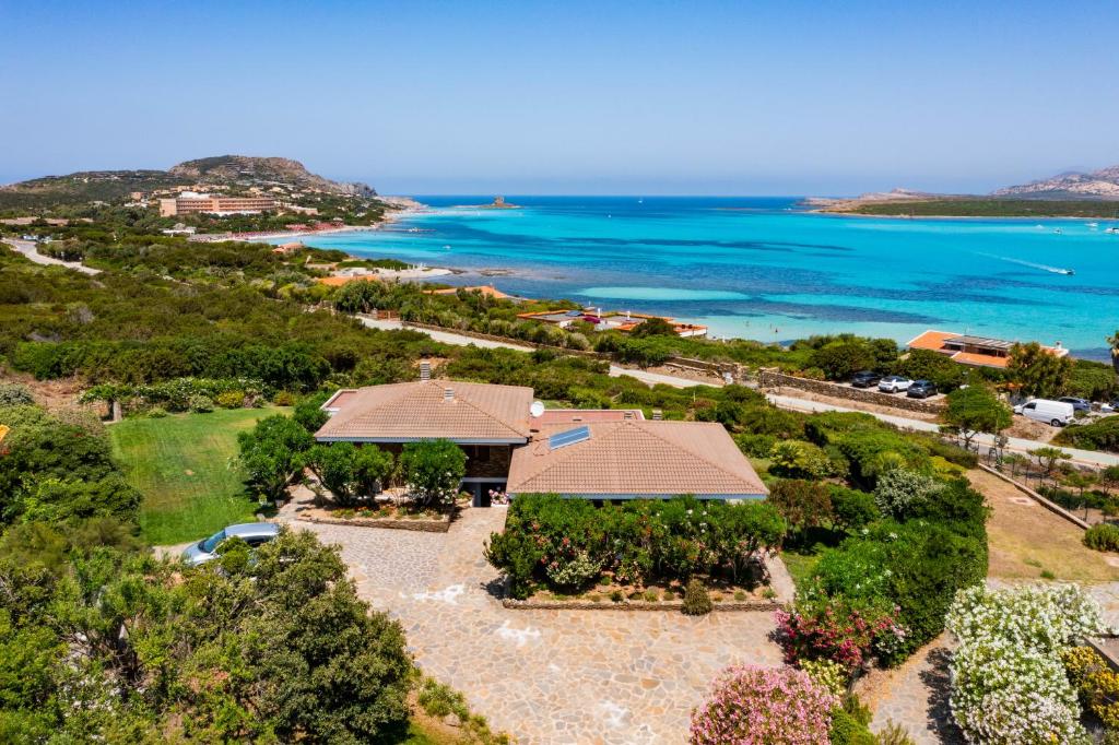 an aerial view of a resort with the ocean at Villa Gino in Stintino