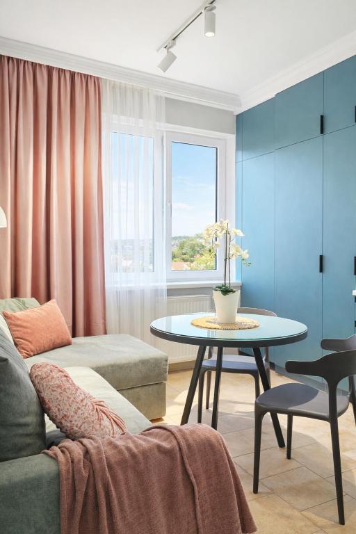 a living room with a couch and a table at Blue Apartment in Mukacheve
