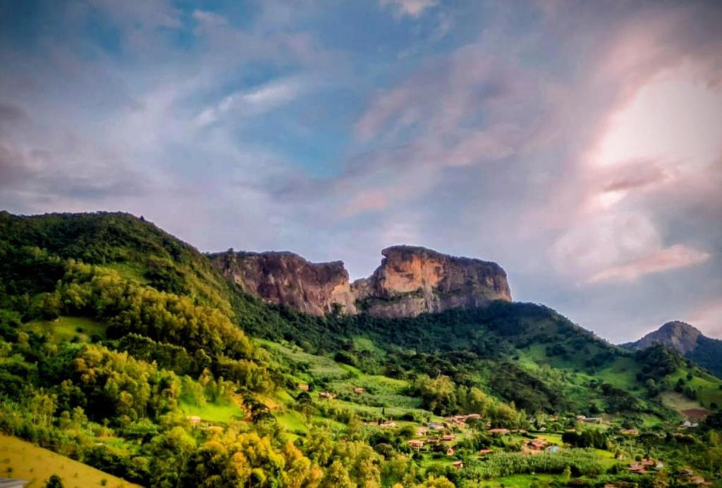 a view of a valley in the mountains at Camping caminho das pedras in São Bento do Sapucaí