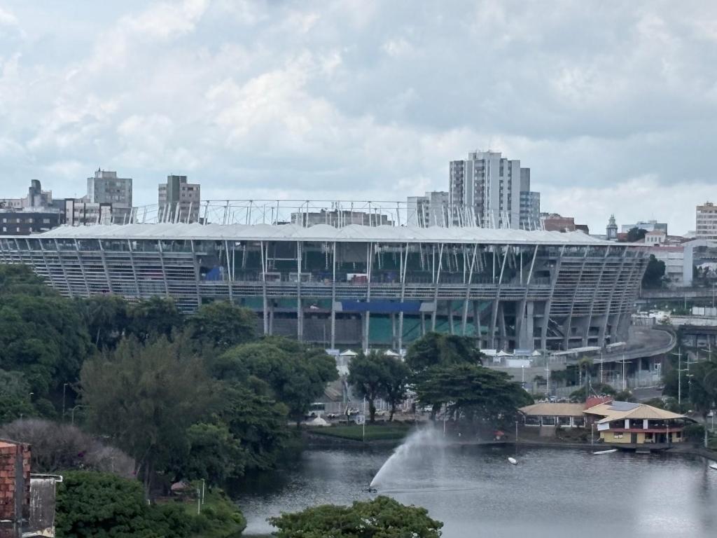 a stadium with a fountain in front of a building at The Brooklyn One in Salvador