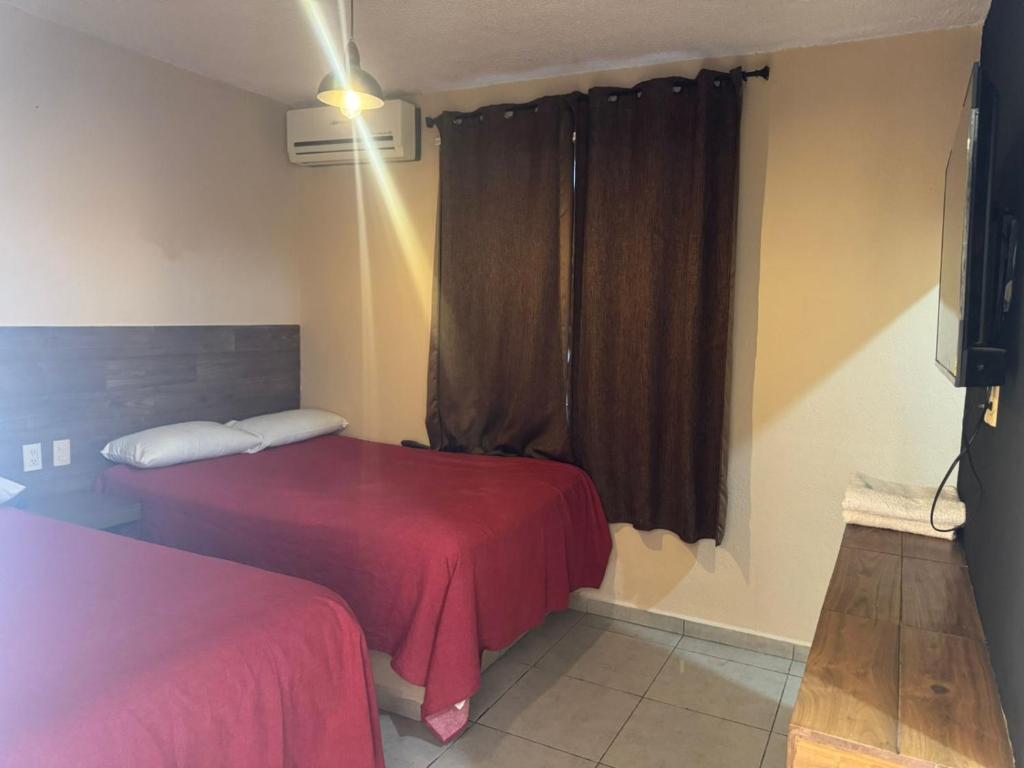 מיטה או מיטות בחדר ב-Hotel Kalin