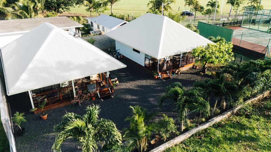 an overhead view of two buildings with white roofs at Nanua Lodge 2 blue in Bora Bora