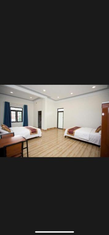 a large room with two beds in it at Linda Home in Phường Chày