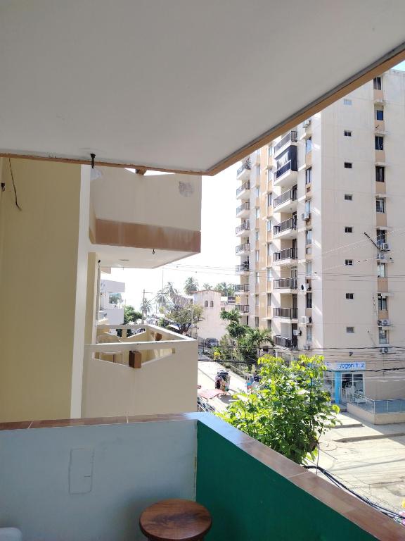 a balcony with a table and a view of a city at Aventura inn 304 in Rodadero