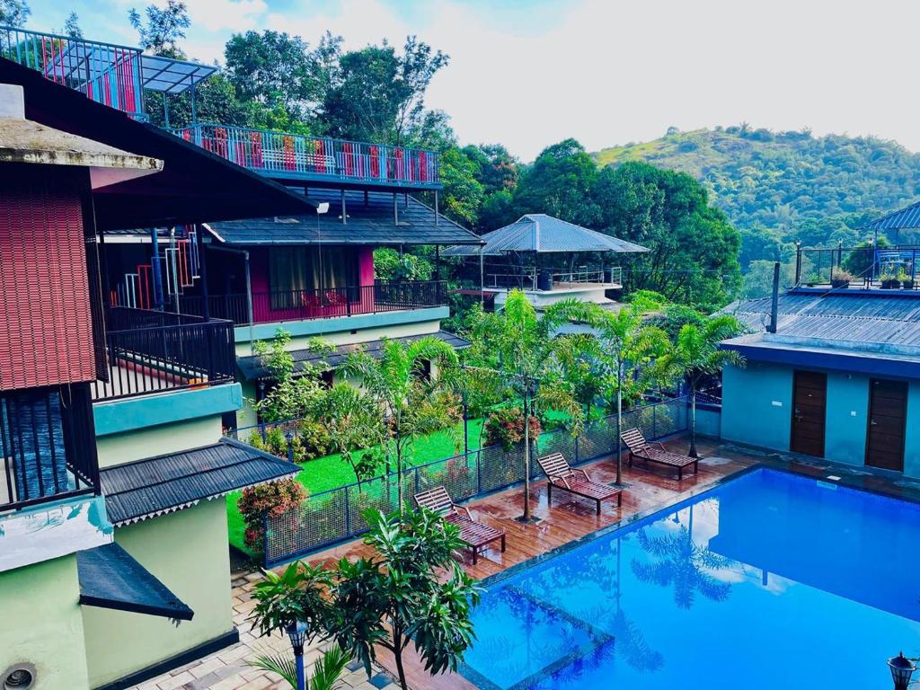 an aerial view of a resort with a swimming pool at Snow Drops Resort in Vythiri