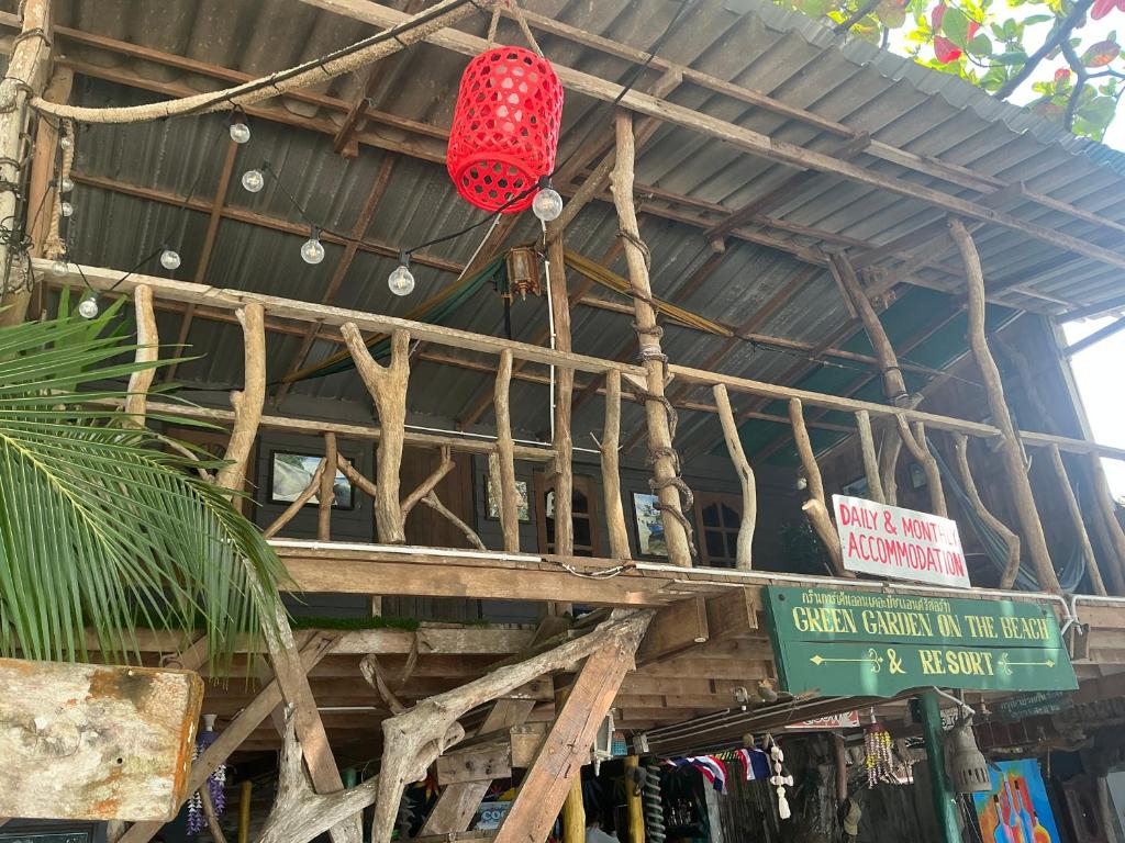 a red lantern hanging from the ceiling of a store at Green Garden Bungalow Resort in Ban Khlong Kloi