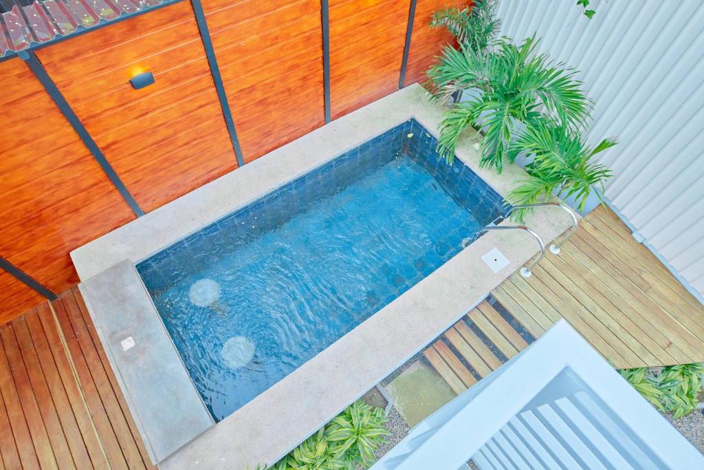 an overhead view of a swimming pool with plants at Butterfly House - Centric 2BR with shared pool in Puerto Viejo