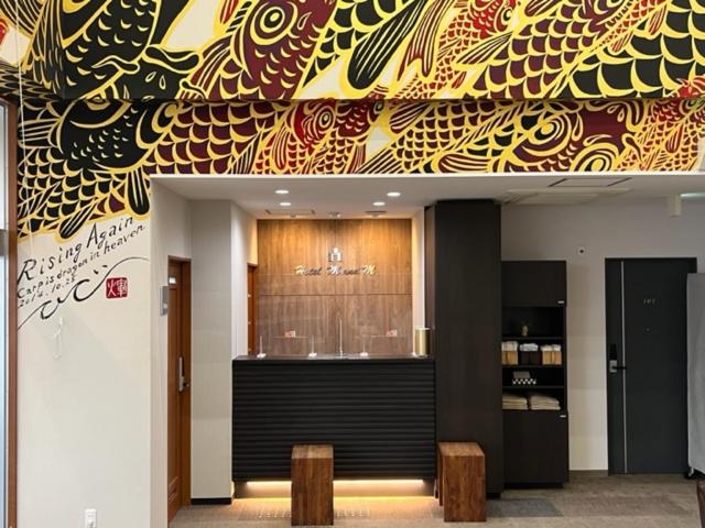a lobby with aasteryasteryasteryasteryasteryasteryasteryasteryasteryasteryasteryastery at Hotel M&M Soma in Soma