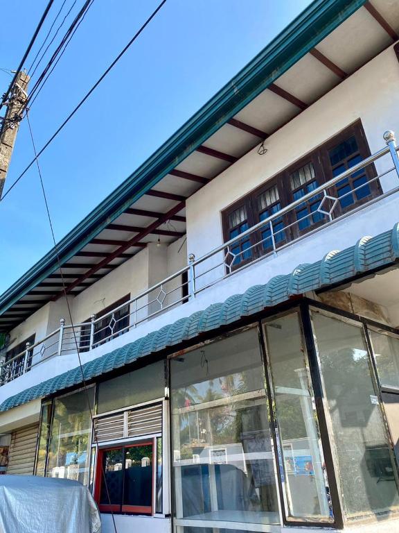a building with windows and balconies on top of it at Fly-In Stay Katunayake in Katunayaka