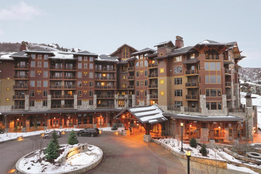 a large building with snow on top of it at Hyatt Centric Park City in Park City