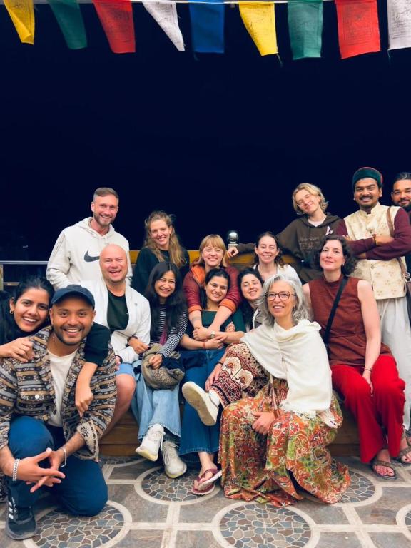 a large group of people posing for a picture at Namaste Hostel Rishikesh in Rishīkesh