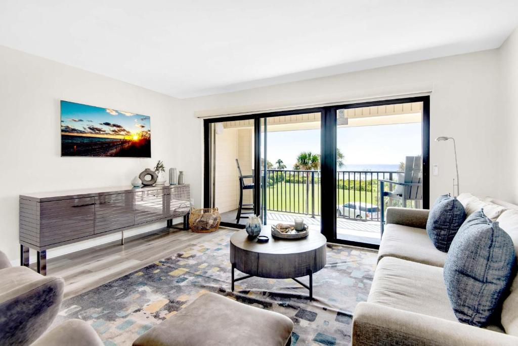 a living room with a couch and a table at Santa Rosa Dunes 721 in Pensacola Beach