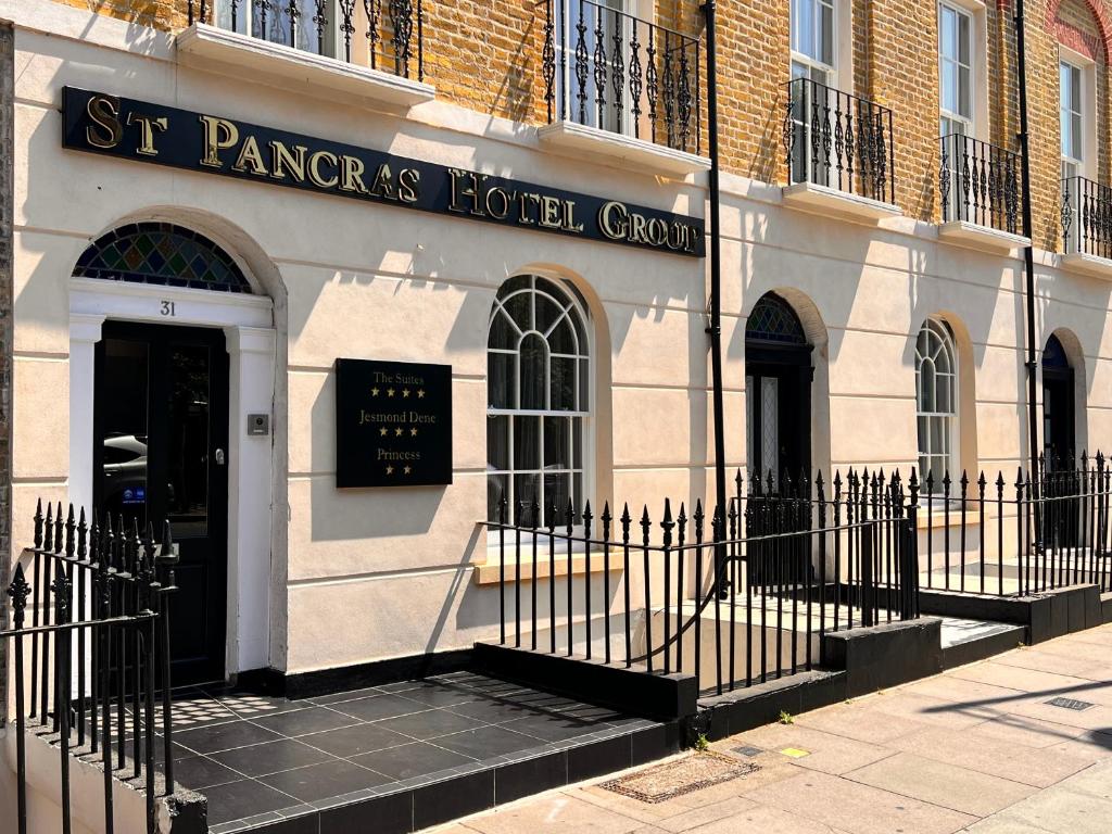 a building with a sign for the st pancras hotel group at The Suites - St Pancras Hotel Group in London