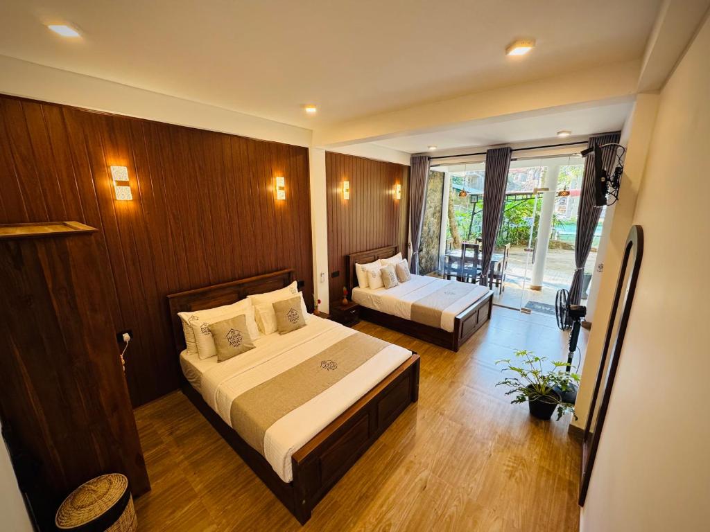 a hotel room with two beds and a window at Home Away Ella in Ella