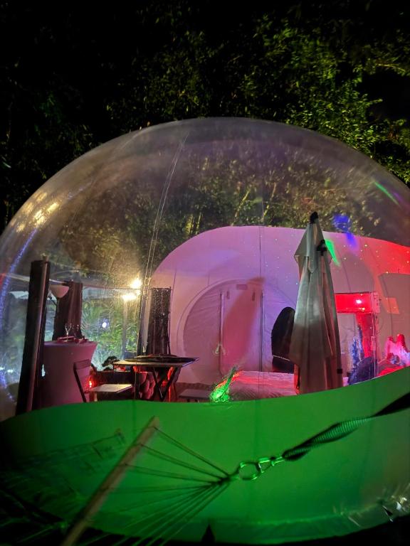 a orb with a person inside of it at Bulle skys evasion in Gros-Morne