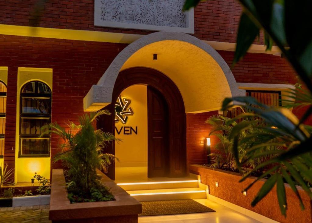 a building with an archway in front of a building at 7EVEN Suites in Lagos