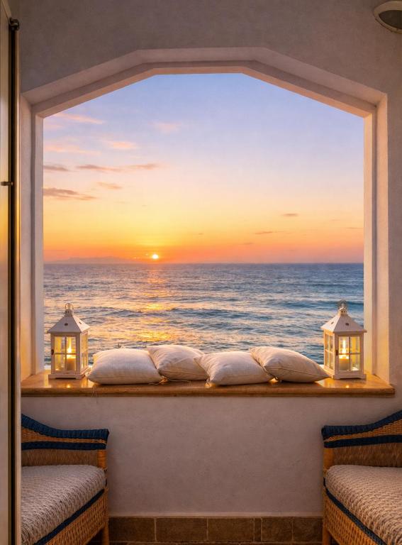 a window with a view of the ocean at Villa Lilla sulla Spiaggia di San Vincenzo LUXURY in San Vincenzo