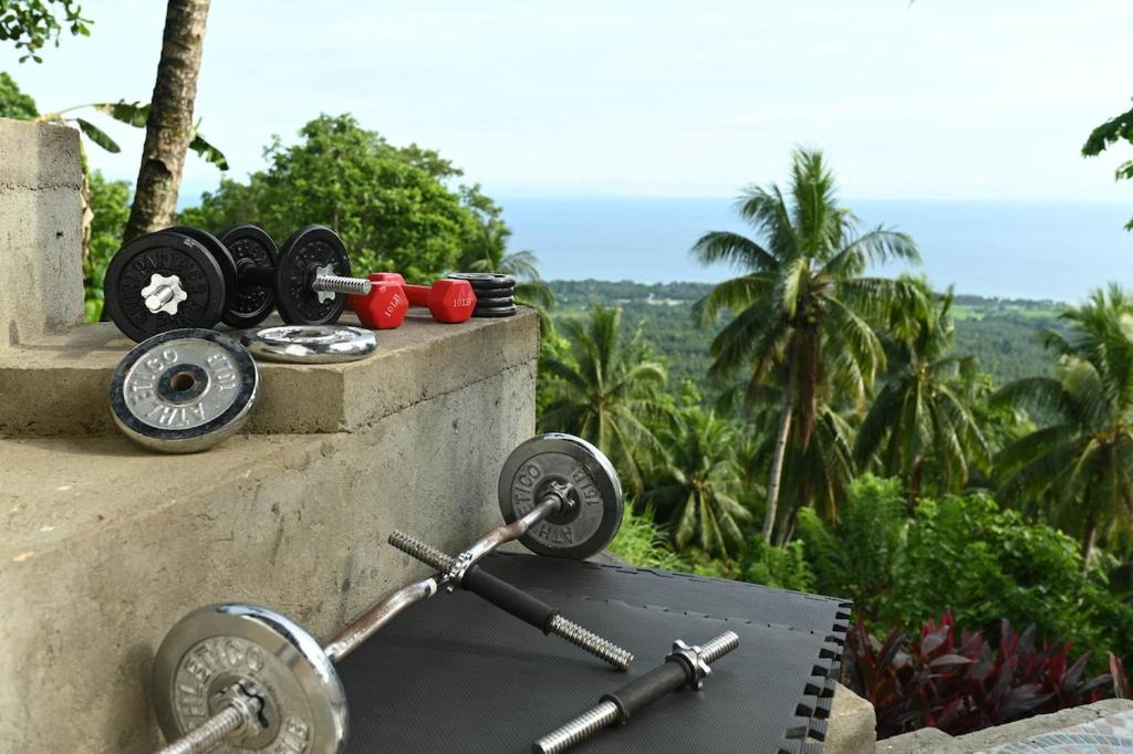 a pile of weights sitting on a wall at el balcon camiguin in Mambajao